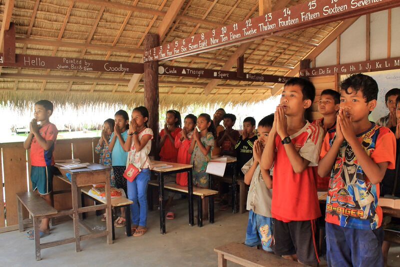 Children reciting daily prayer cambodia school