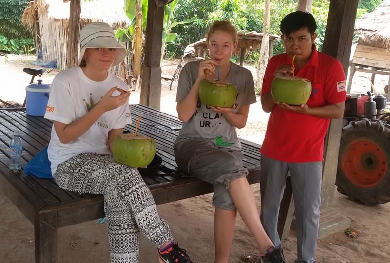 drinking fresh coconuts with friends