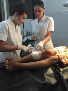 medical intern performing basic procedure