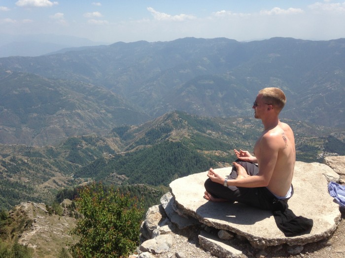 buddhist pose on a mountain