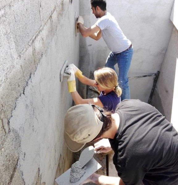 layering cement on wall