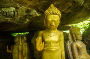 statue of buddha with hand