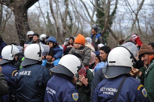 police patrol the greece refugee camp areas
