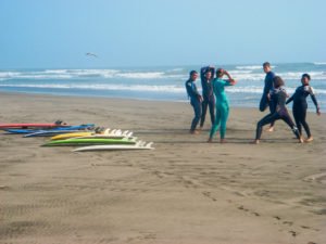 pimental surfing on volunteer trip