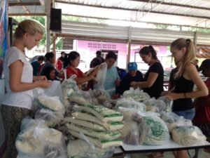 at the markets helping the locals