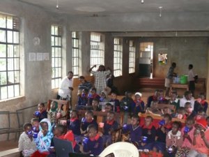 children in a school auditorium in Kenya Africa