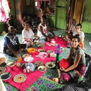 Volunteer-in-fiji-sitting-with-villagers-having-talk-about-nutrition