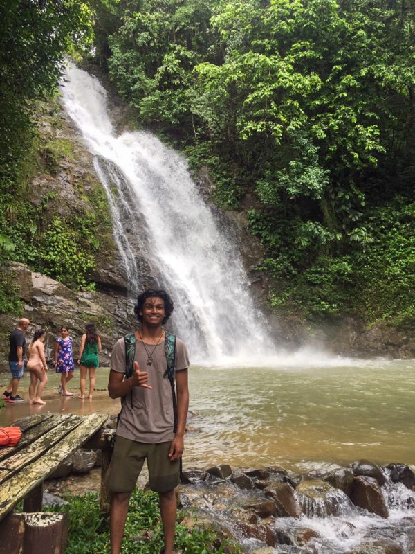 IVI volunteer by waterfall in Fiji