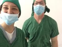 volunteer selfie in scrubs on Tanzania medical project