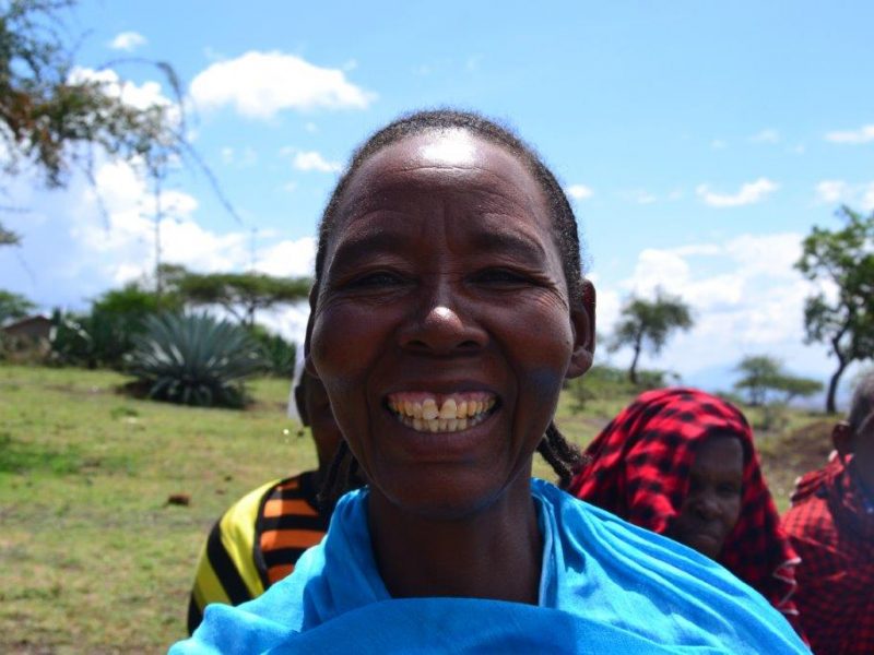 local Tanzanian woman smiling at camera