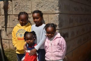 Group of local children kenya volunteering ivi
