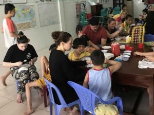 IVI volunteer feeding a child