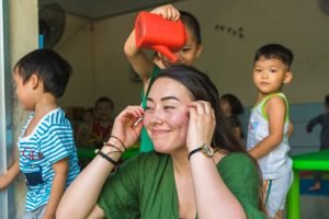 Participant playing with kids