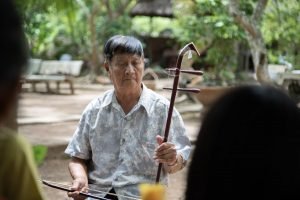 Playing Vietnamese musical instrument