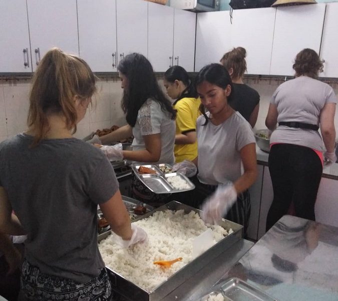 Preparing food IVI volunteers