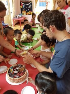Serving a cake to the kids-Ho Chi Minh