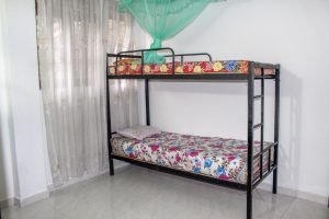a bed with a mosquito net (Kandy)