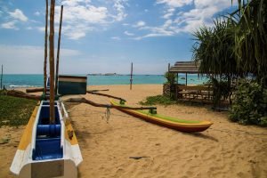 boat on beach next to turtle centre