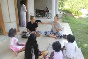 sitting with small group of kids