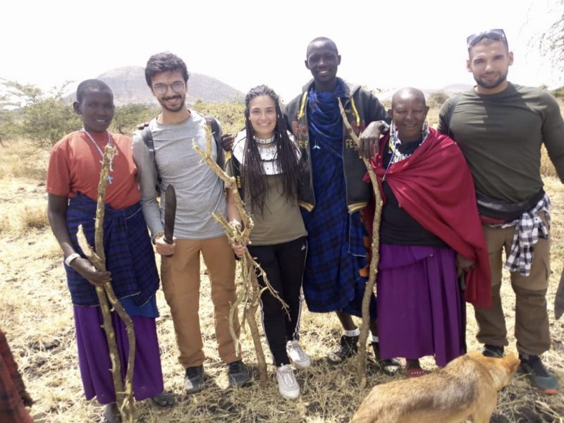 Group photo of with the Maasai people and ivi volunteers