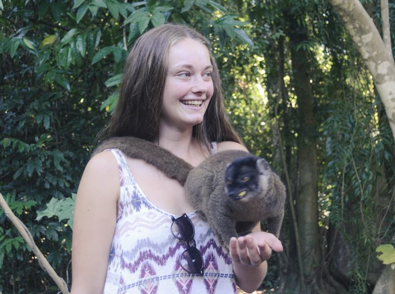IVI volunteer holding lemur