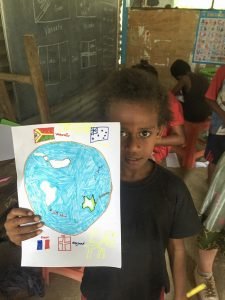 child holding up drawing