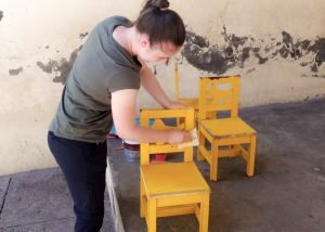 Painting student chairs and tables-