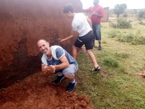 Participant helping maasai people building a new house for bride (1)