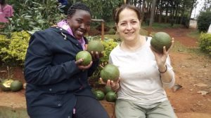 Participant posing with big avocadoes