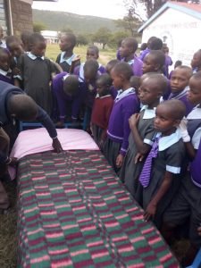 Students looking the bed