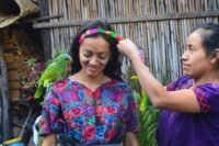 girl with parrot on her shoulder