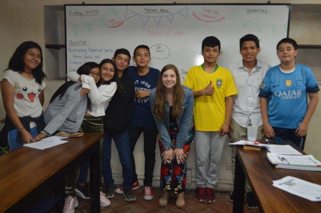 group standing in front of the whiteboard