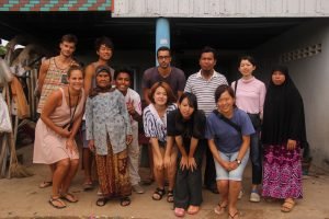 Group photo of participants with locals