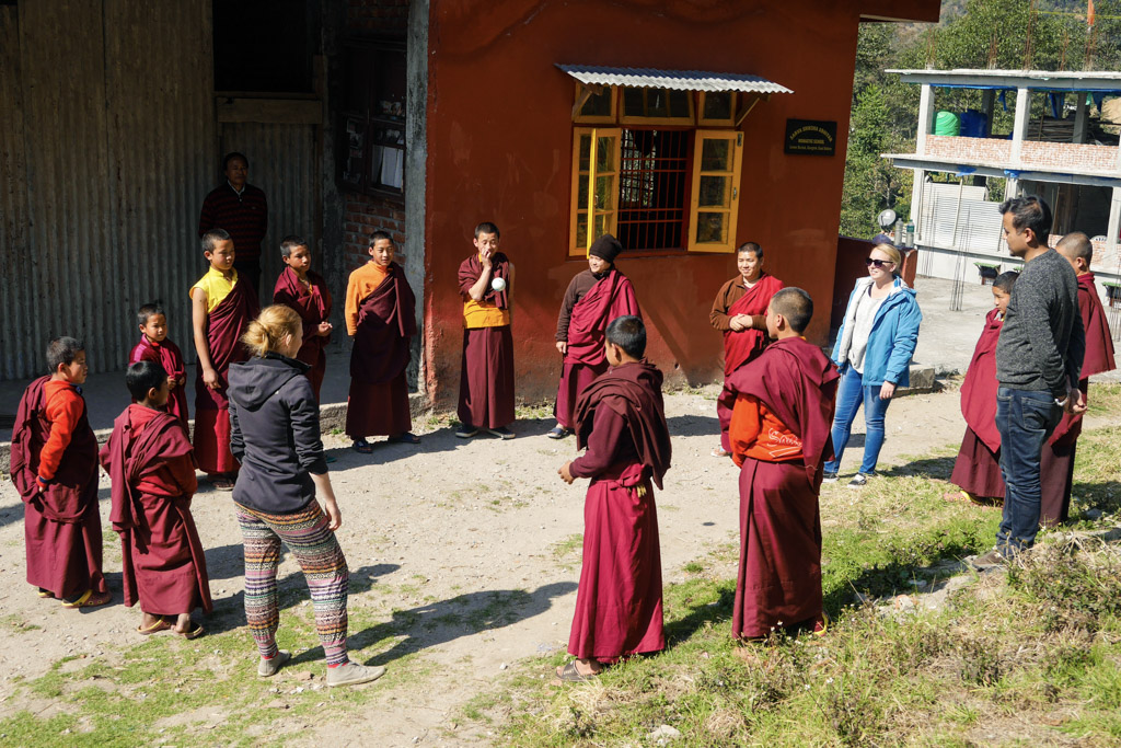standing in a circle with the monks