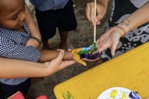 painting childs hand