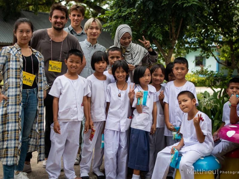 Group photo of participants with students