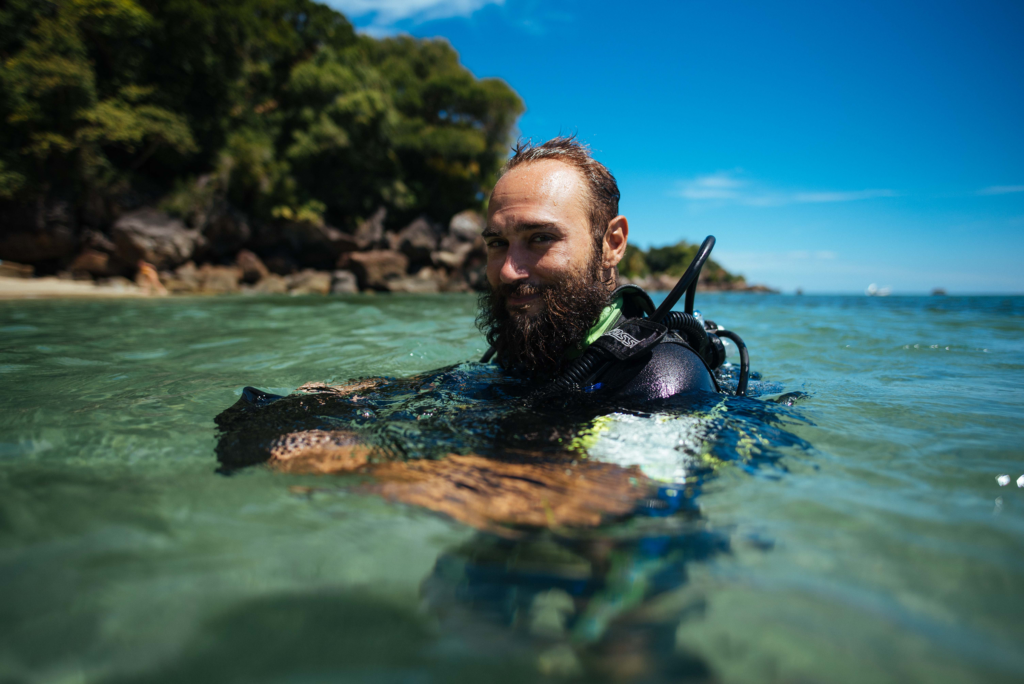 volunteer in water with dive gear