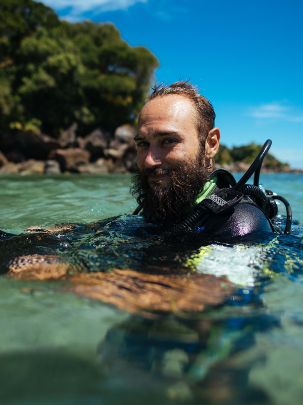 volunteer in water with dive gear