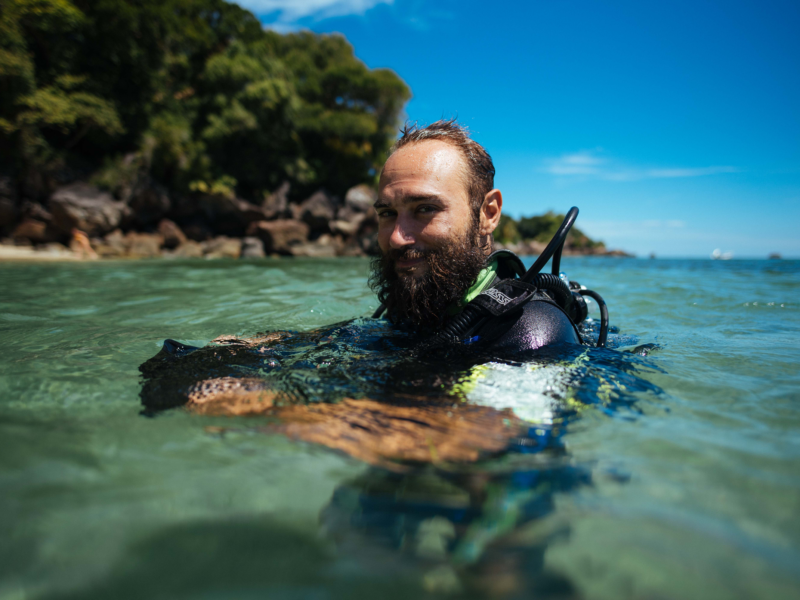 volunteer in water with dive gear