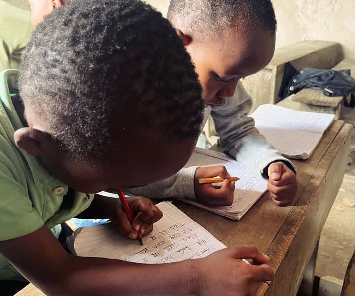 kids writing in books