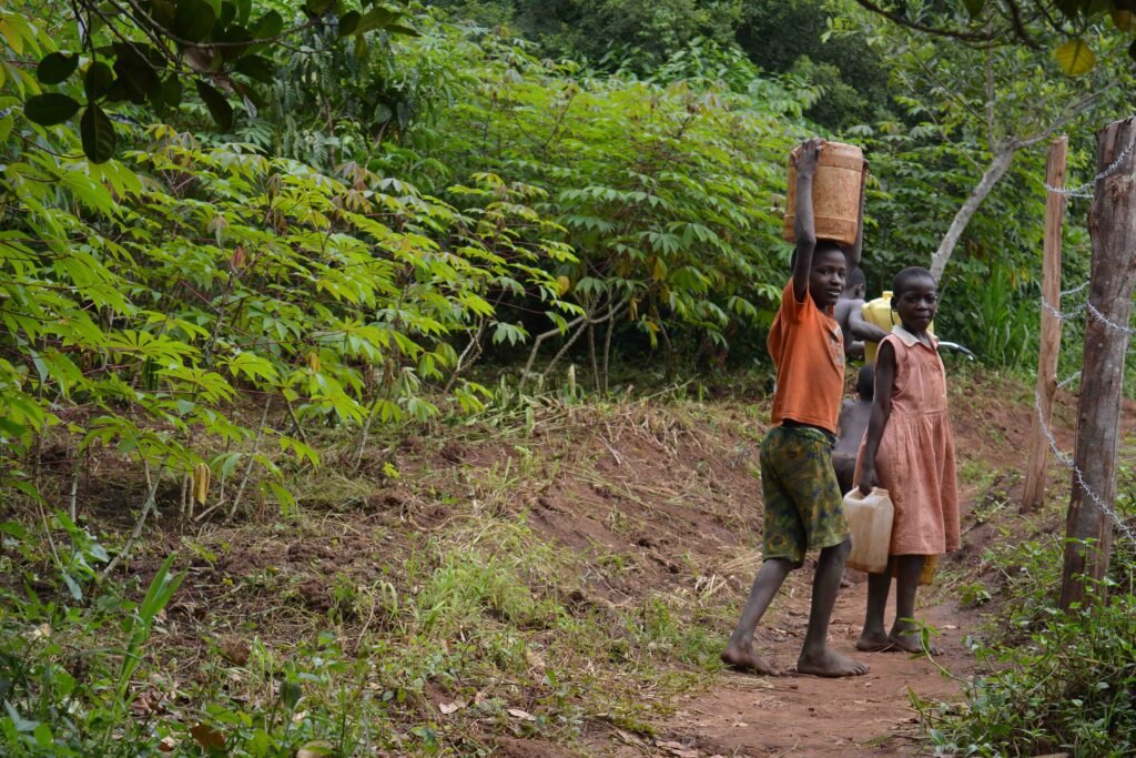 local kids smiling in uganda