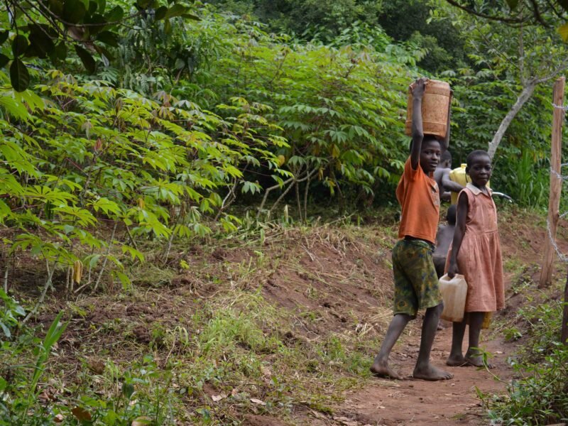 local kids smiling in uganda