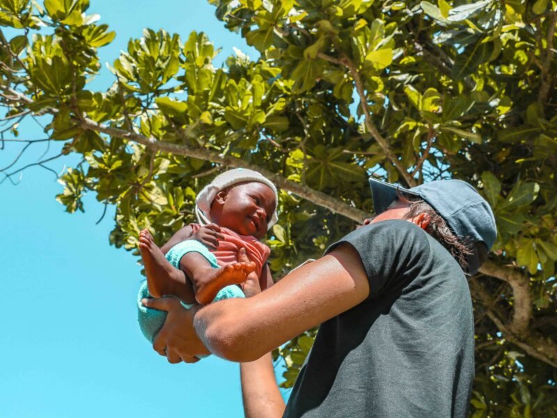 Participant enjoying a moment with a child