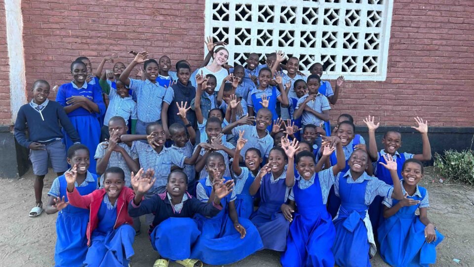 volunteer with students in Malawi