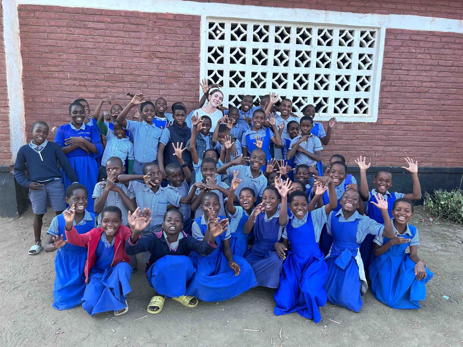 volunteer with students in Malawi