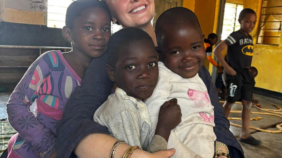 volunteer with students in Malawi