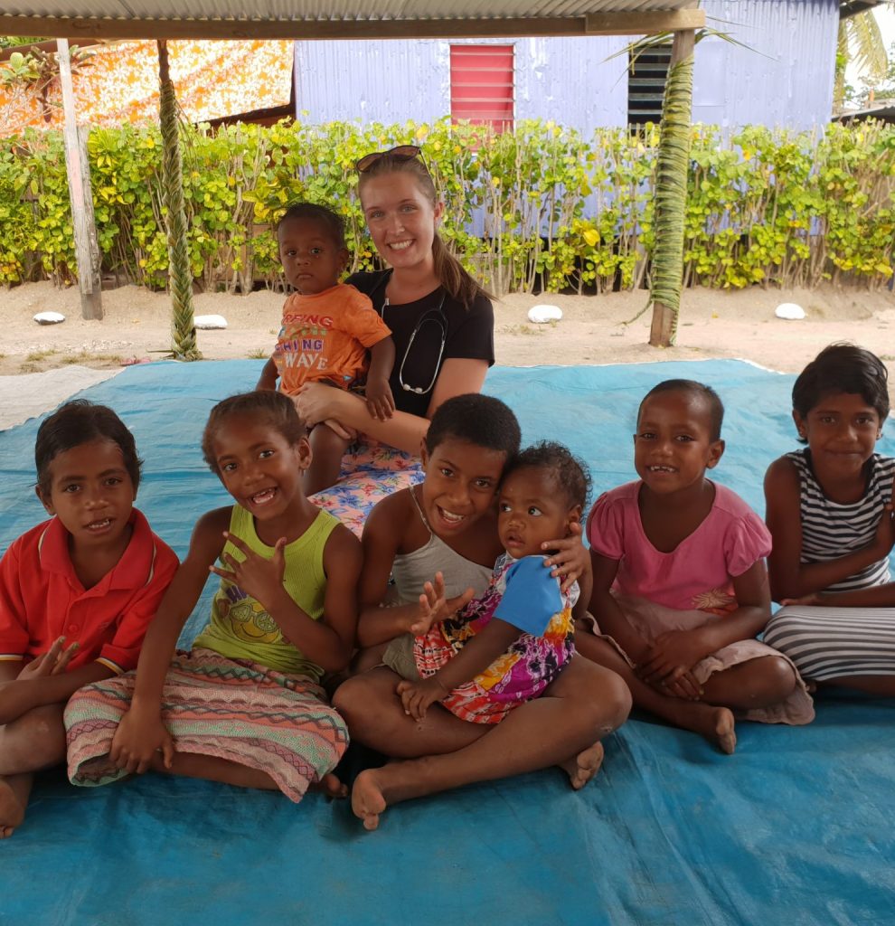 Beth franks with the children in the village in fiji