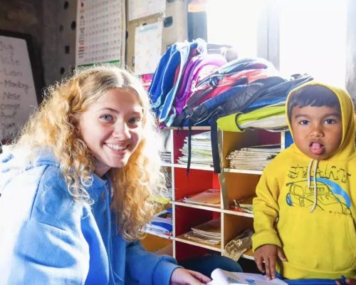 IVI-volunteer-with-young-child-in-Nepal-min-1