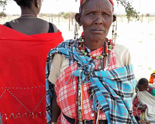 KE-Maasai-Mara-community-woman-scaled