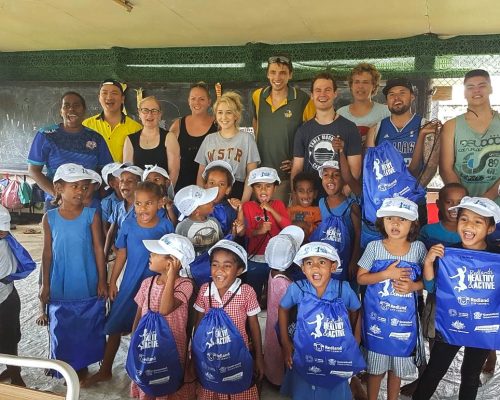 IVI volunteers with children in Fiji